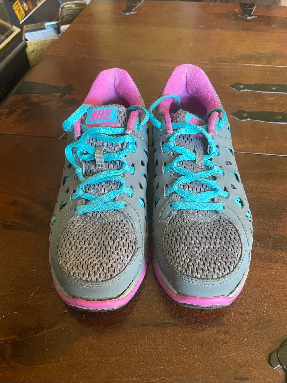 Nike Women's Gray Athletic Sneakers with Pink Interior and Teal Laces